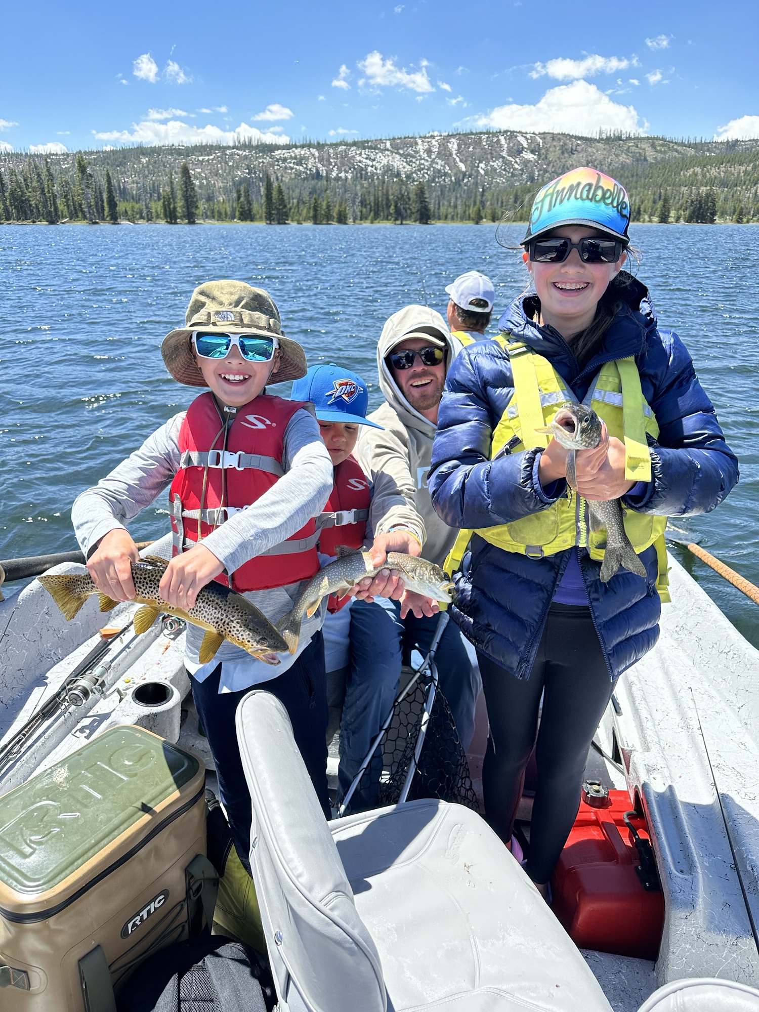 Family fishing on drift boat with Teton South Fish and Float